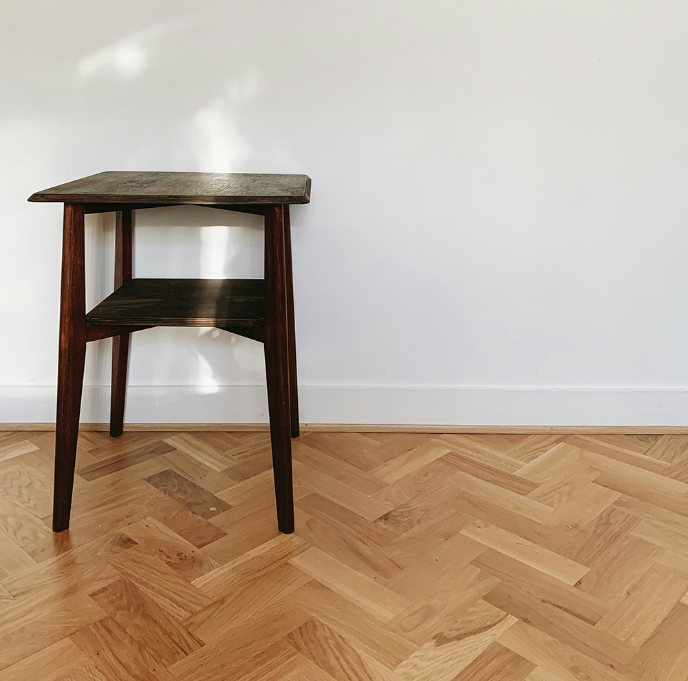 an image of a wooden floor in home with white scotia beading