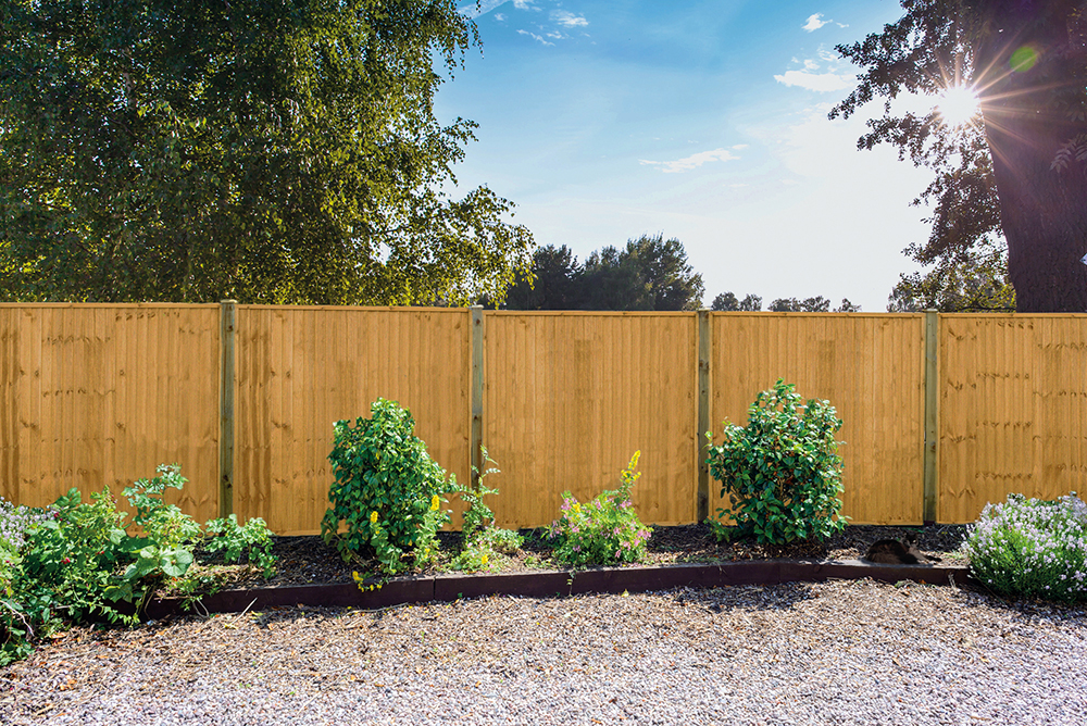 an image of fence panel clips inserted into a beige coloured fence. 