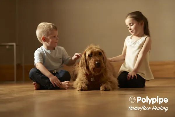 Image of underfloor heating being used with a dog and two children. Image of underfloor heating being used with a dog and two children.