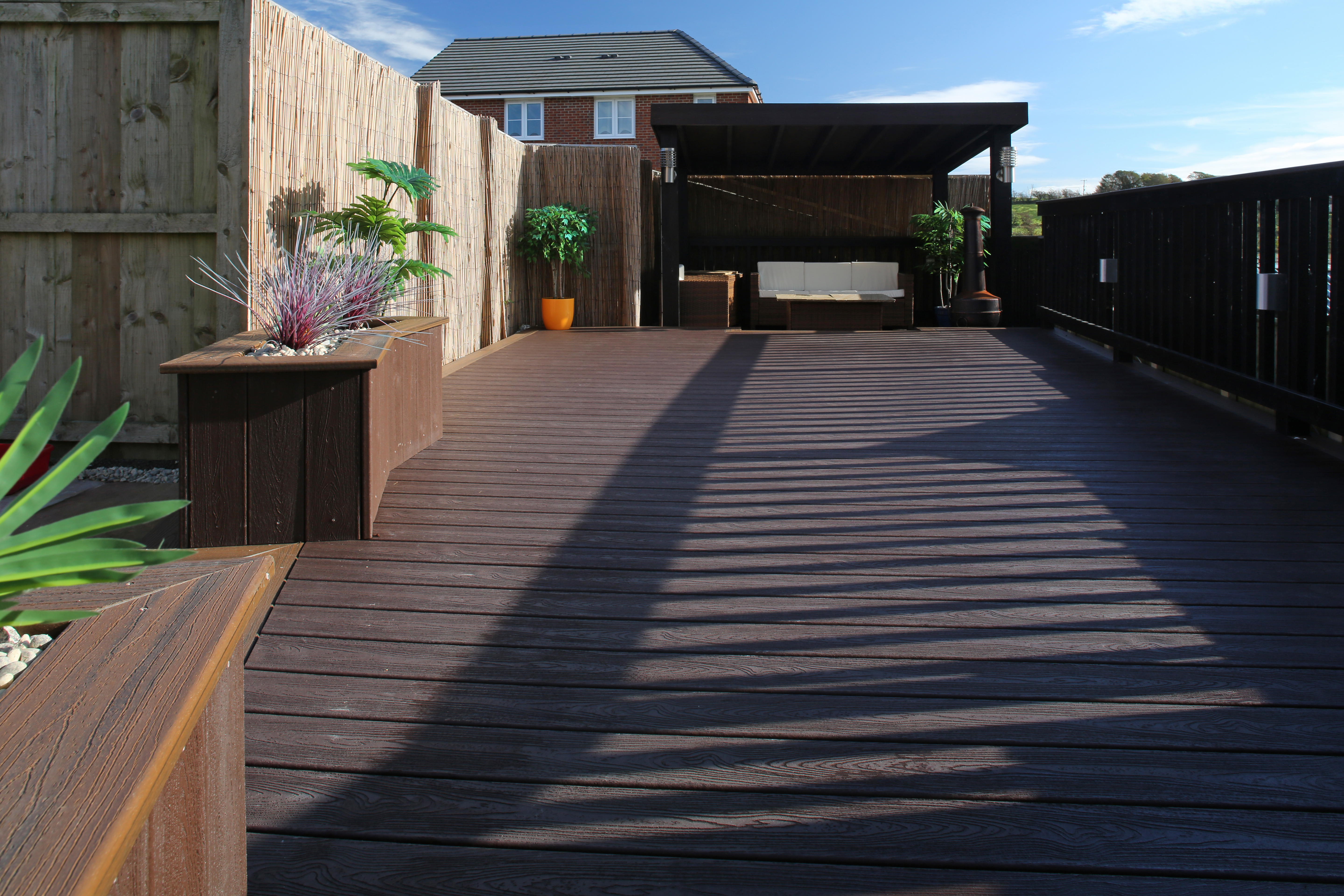 Brighten up your outdoor space with painted or stained decking - which is cost-effective for your garden. Brighten up your outdoor space with painted or stained decking - which is cost-effective for your garden.