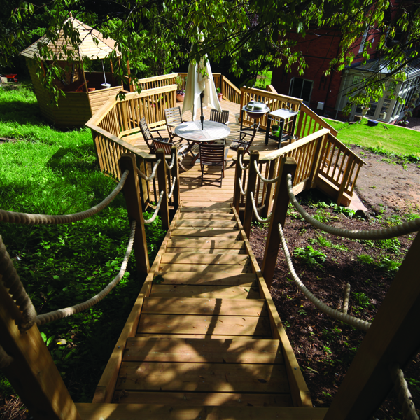 Use garden decking to design a child-friendly play area to make the most of space whilst keeping things safe and stylish.