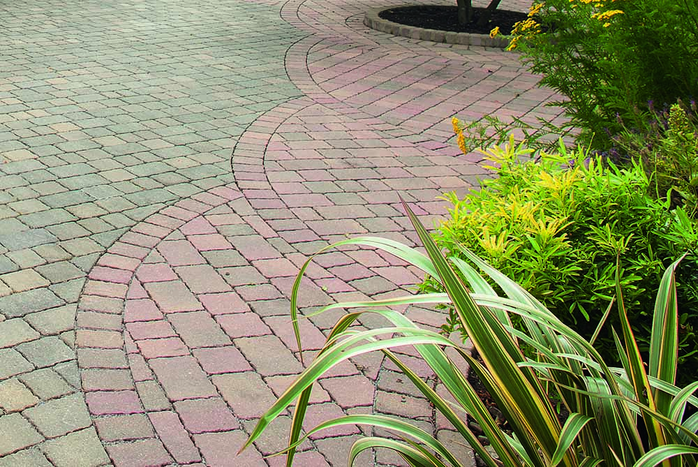 Another stunning block paving pattern for decorative pathways, patios and entrances is the fan pattern. This involves laying the blocks in a semi-circular fan shape, starting and emanating from the middle.