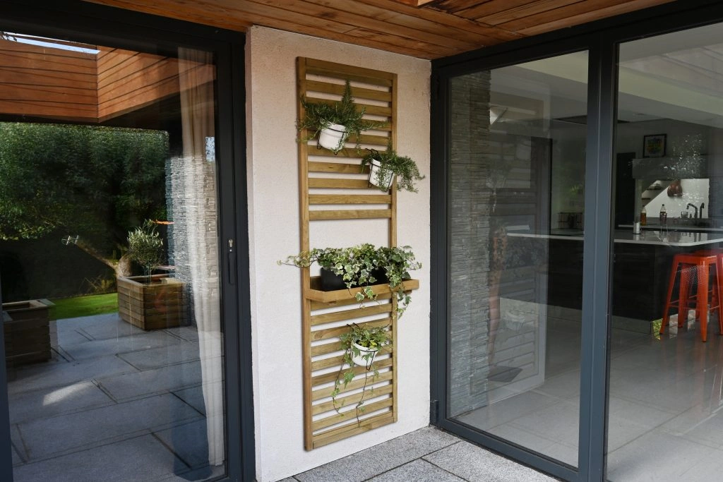 A Slatted Wall Planter One Shelf from Forest Garden, used for incorporating plants and herbs outside. A Slatted Wall Planter One Shelf from Forest Garden, used for incorporating plants and herbs outside.