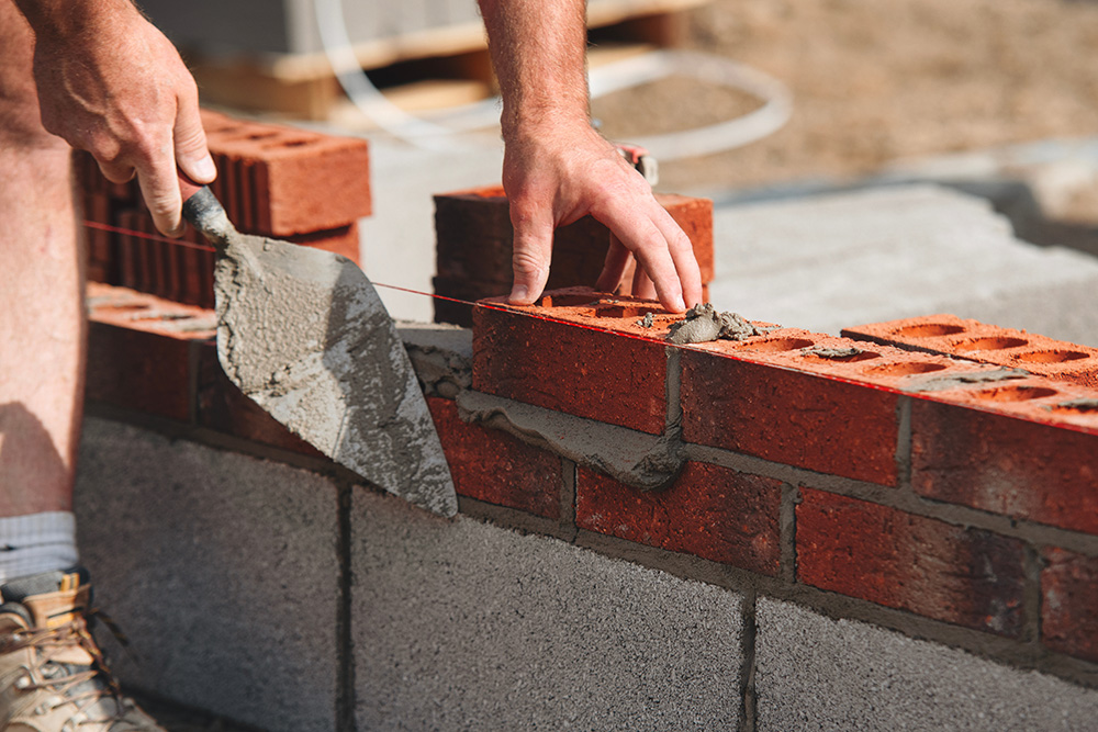 Mortar is a creamy mix of cement, sand and sometimes lime, which contains small air bubbles to enable it to expand and contract to stop damage from frozen water. 