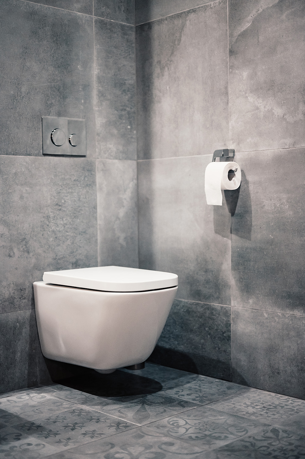Outdoor toilet with grey tiles