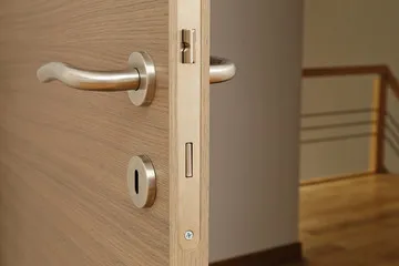 An internal door handle, where you can see the holes within the latch. 