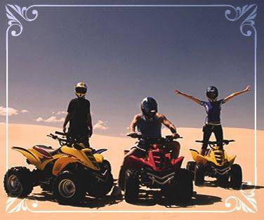 friends on quad bikes in the desert
