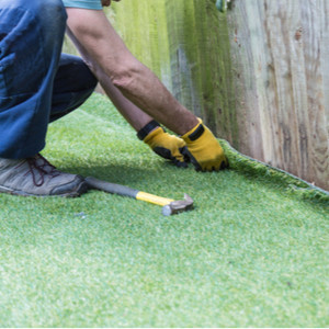 Why is Sand Spread Over an Artificial Lawn?