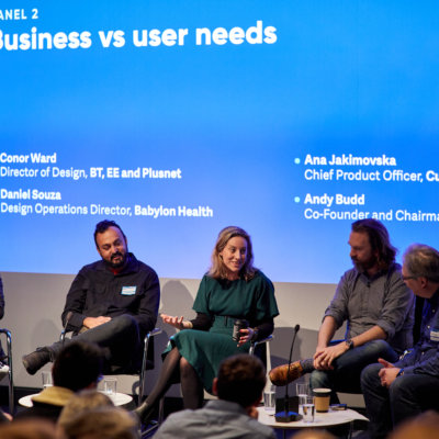Clearleft design leadership panel sitting infront of a blue screen
