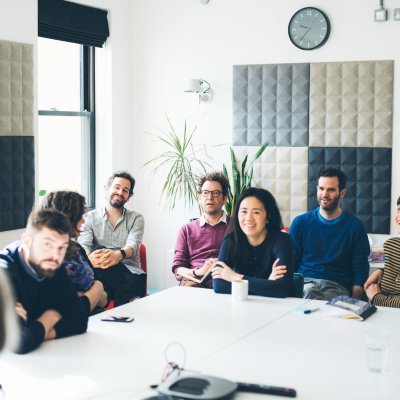 A group of clearlefties sat at the board room table smiling