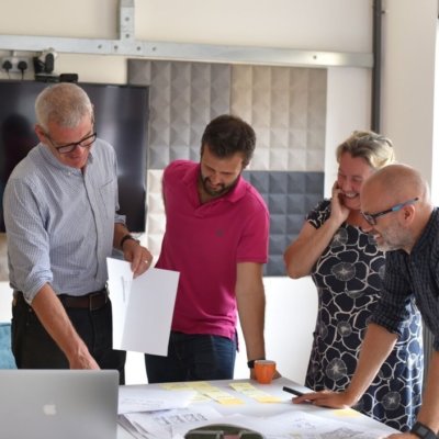 A group of people reviewing designs