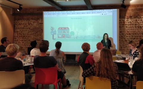 Sarah demonstrating an animation to an attentive audience