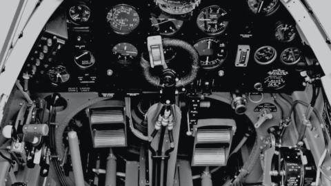 The many controls in the cockpit of a World War Two figher plane.