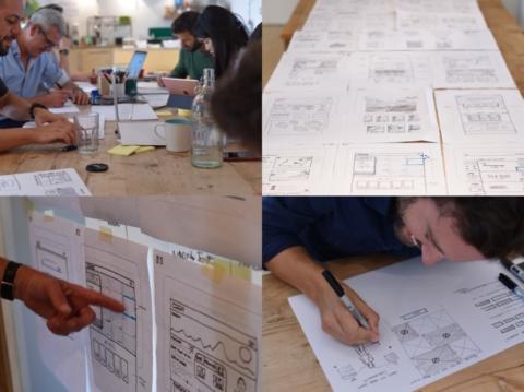 A group of people sketching wireframes