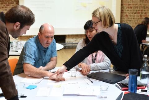 A group of people running a form design workshop