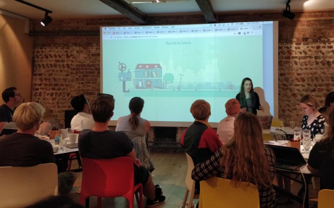 Sarah demonstrating an animation to an attentive audience