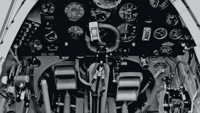 The many controls in the cockpit of a World War Two figher plane.