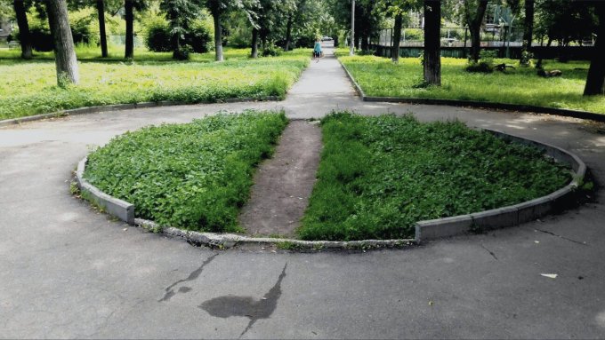 A green area with a pathway tramped across it.