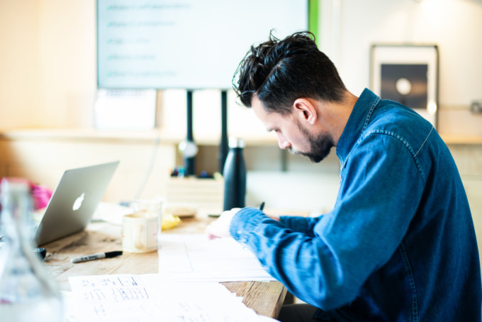 Running a design sprint with a screen and laptop