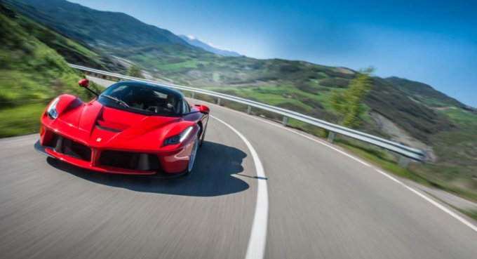 A Ferrari driving through the mountains
