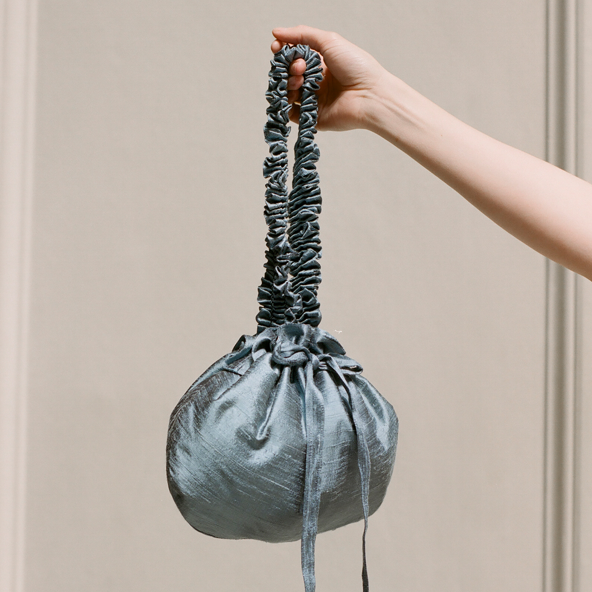 Smocked cornflower silk bag by Cawley Studio Smocked cornflower silk bag by Cawley Studio