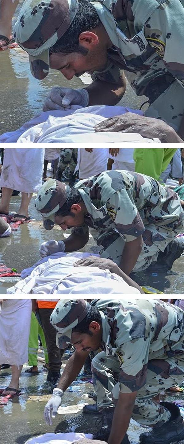 أحد منسوبي قوات الطوارئ يلقن حاجاً آسيوياً سقط في تدافع 