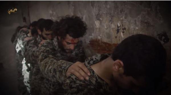 بالصور.. تنظيم داعش يبث مقطع لإعدام عشرات الجنود السوريين على يد فتية بالصور.. تنظيم داعش يبث مقطع لإعدام عشرات الجنود السوريين على يد فتية