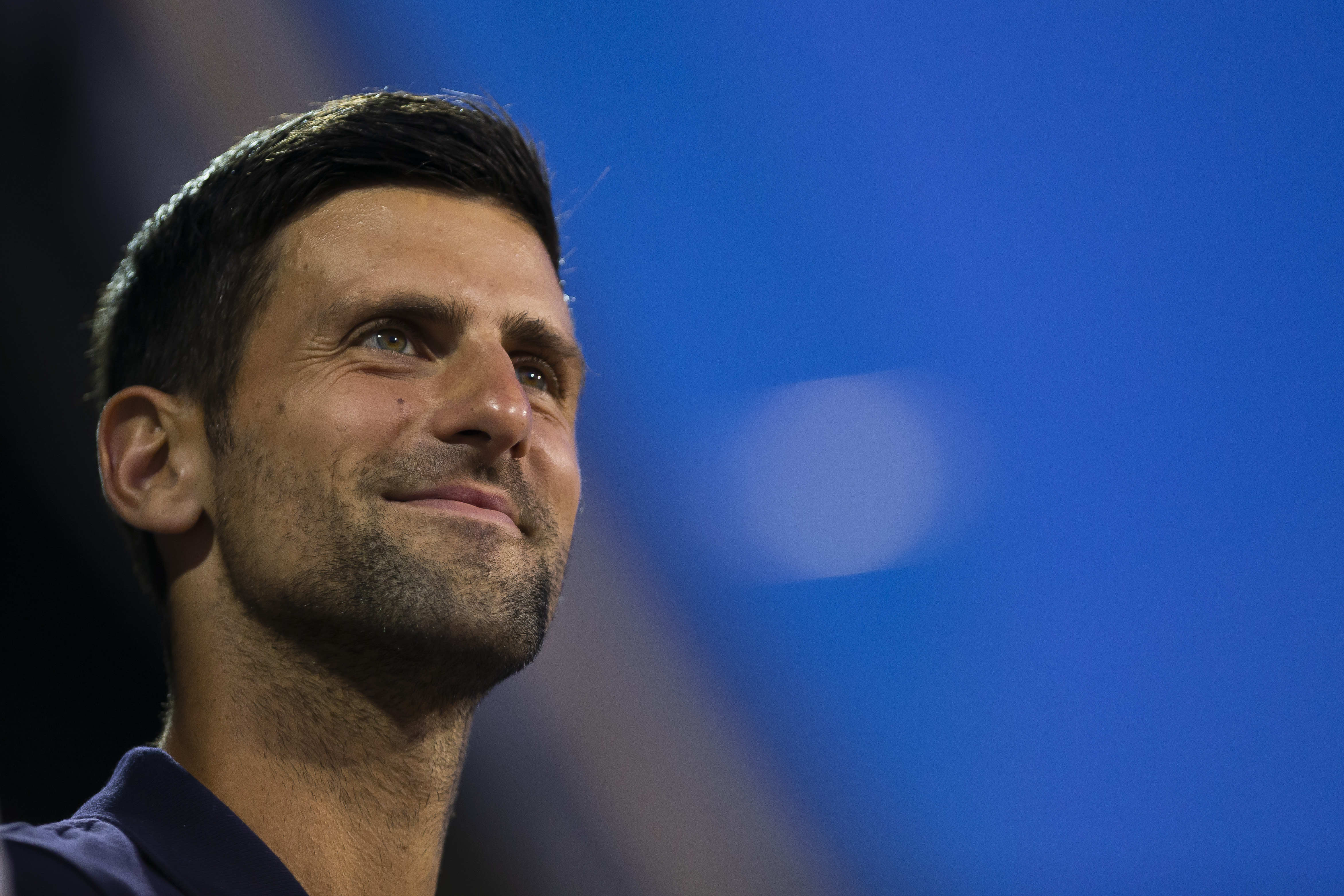 Novak Djokovic watches the final Adria Tour match