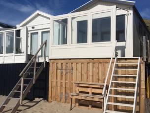 Slaapstrandhuisje bij Dishoek direct aan zee met panoramisch uitzicht en terras | 342