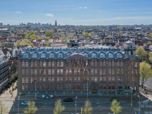 WOW! Overnacht in een DELUXE kamer in het MONUMENTALE Scheepvaarthuis in hartje Amsterdam incl. ontbijt & NS treinretour
