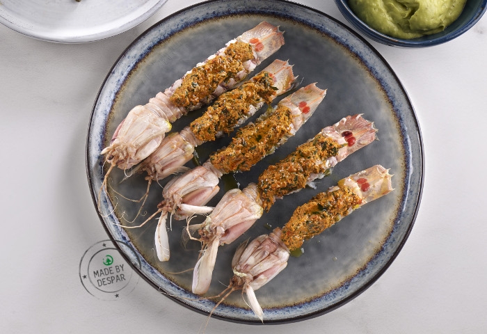 Canocchie al vapore con pesto di cicoria e pomodori secchi