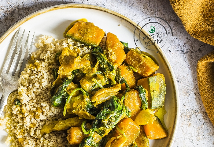 Cous cous con curry di zucca, pollo e spinaci