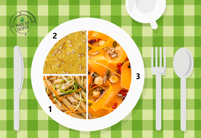 Piatto unico: carote con frutta secca, penne integrali e hummus di ceci
