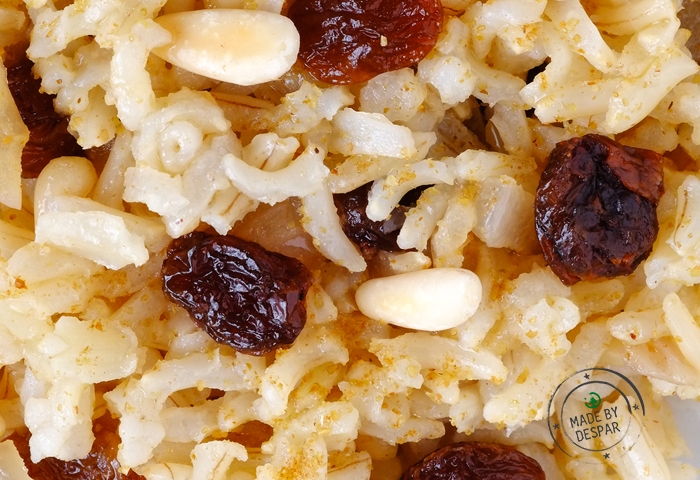 Riso integrale all'uvetta, pinoli e cumino