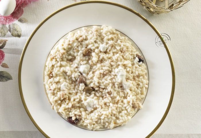 Risotto con ragù bianco di coniglio, olive e burrata