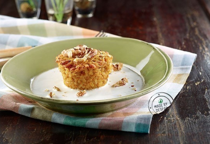 Sformatini di riso integrale con zucca, noci e noce moscata su fonduta al caprino