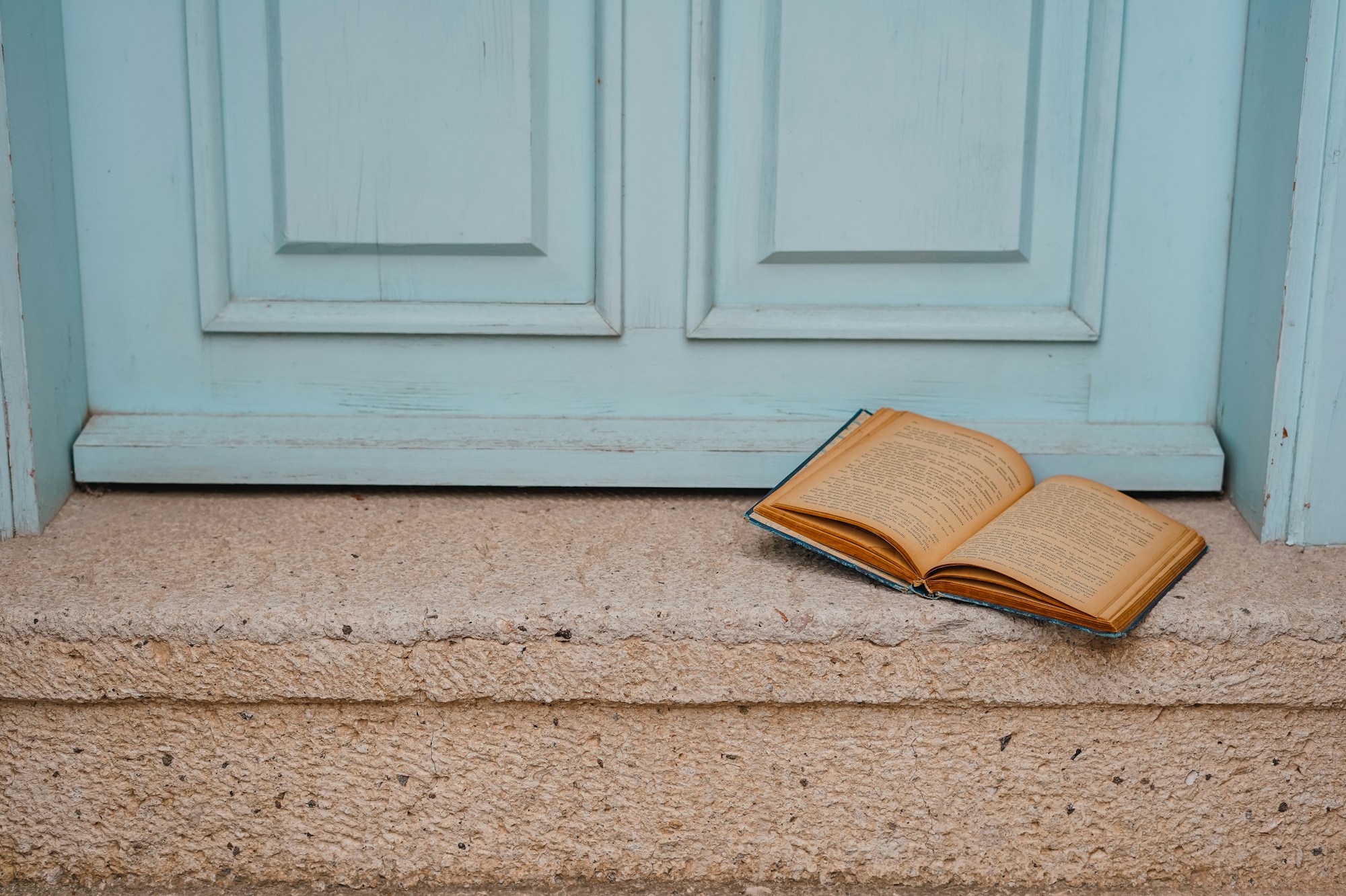 Open book on a door step