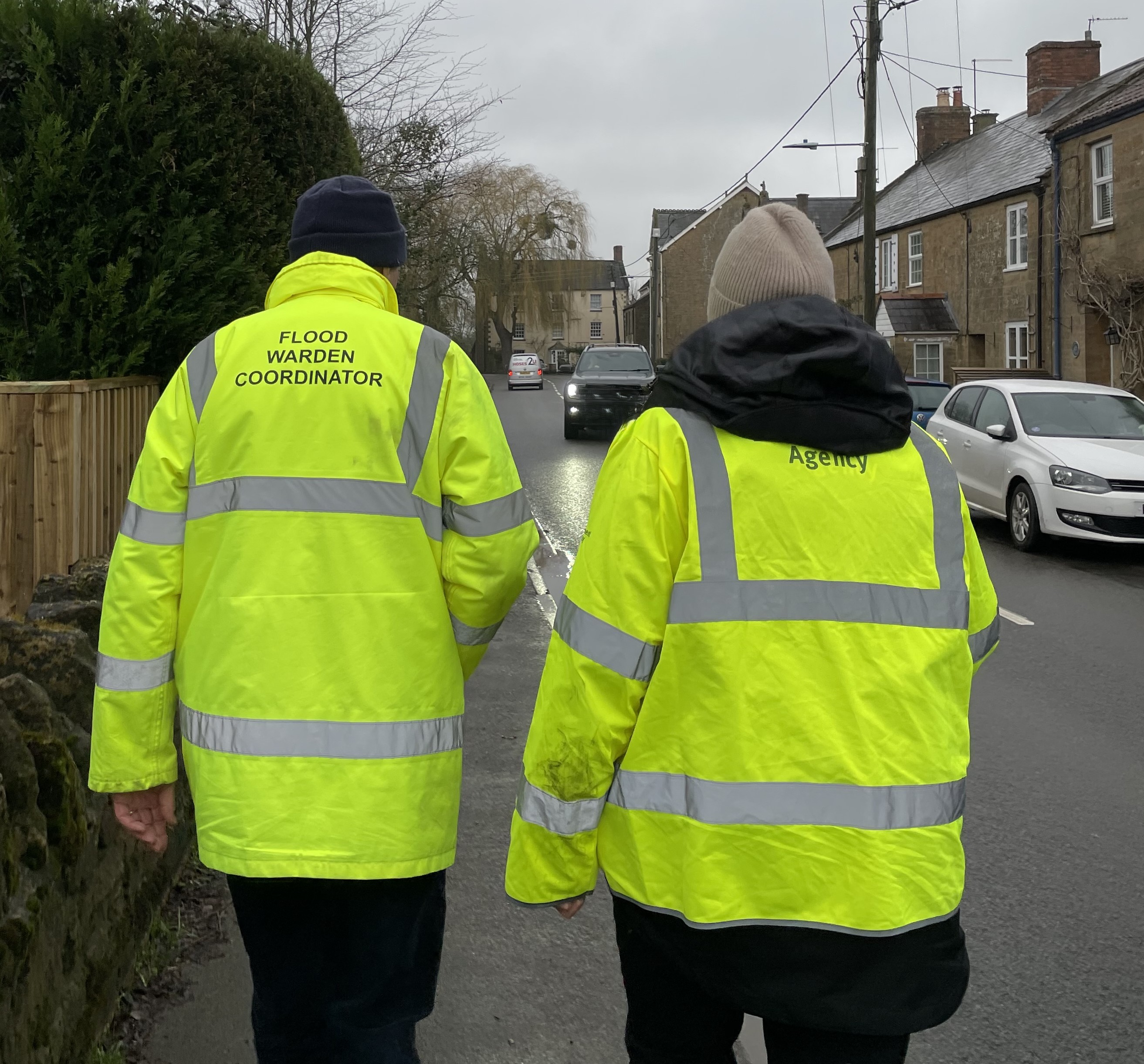 Flood Warden Co-ordinator and Environment Agency staff walking down the road together