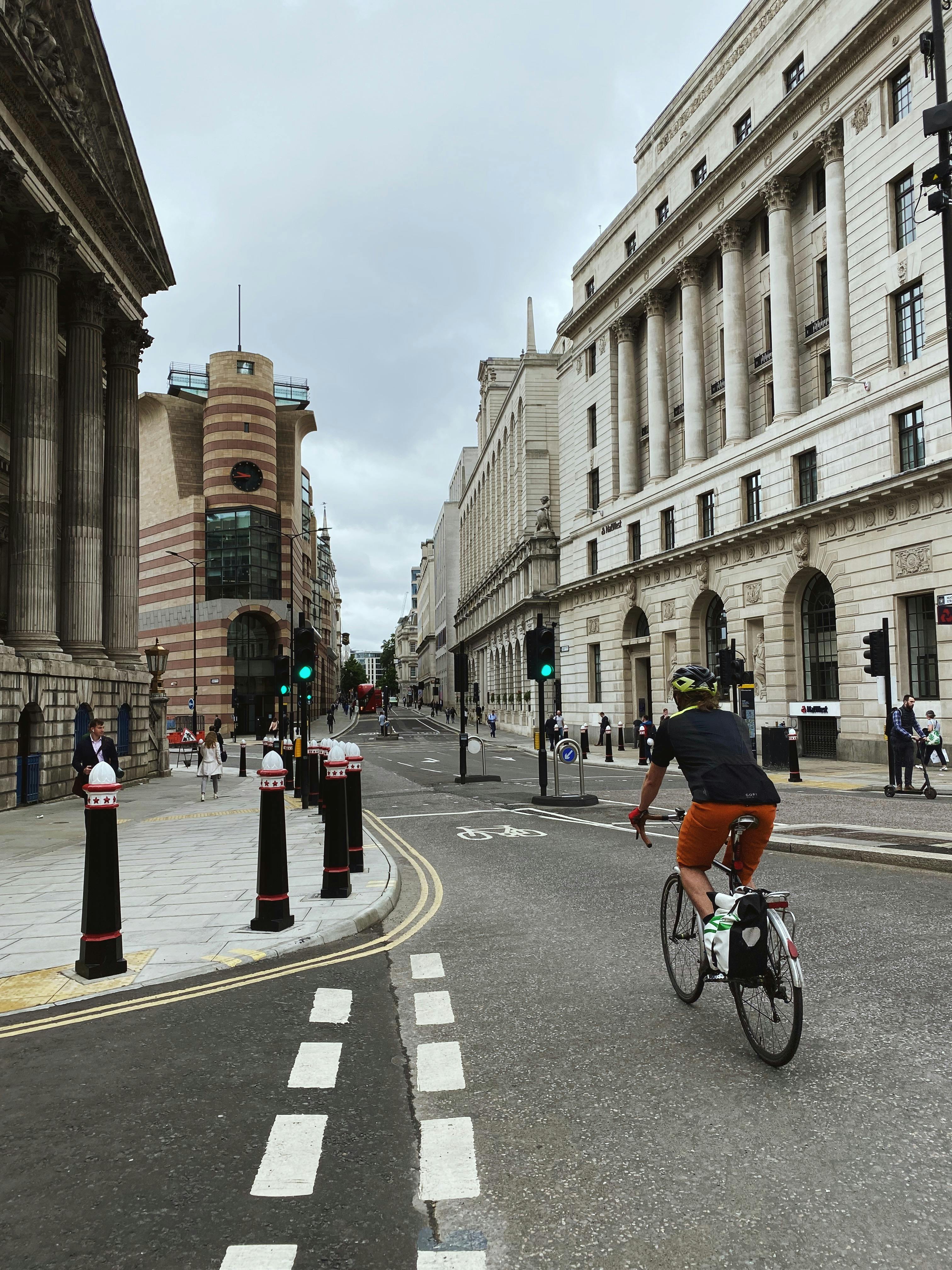 Image of a cyclist riding past a traffic junction