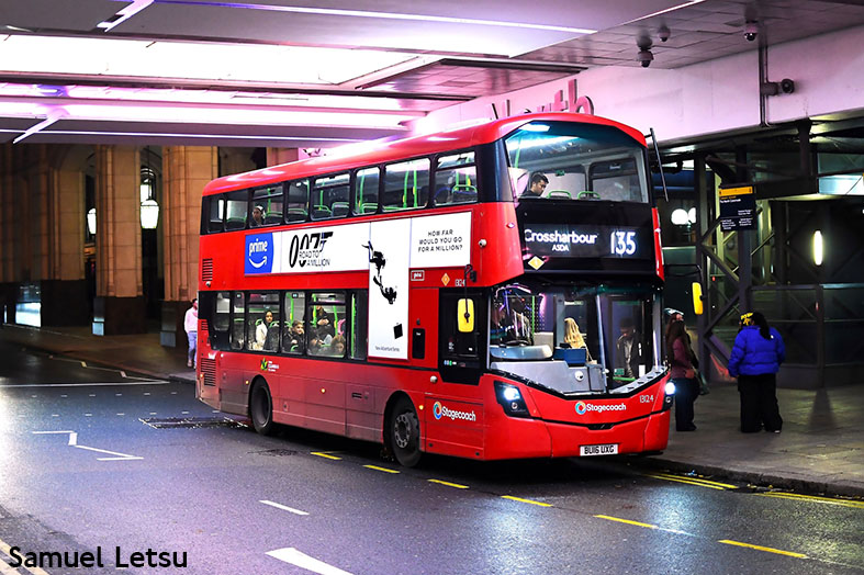 Red double decker Route 135 bus at a city centre bus stop