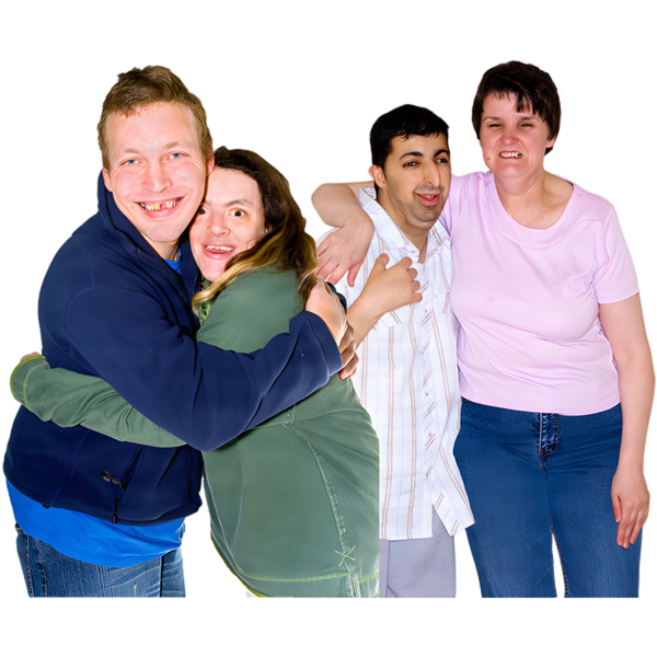 Four adults standing close together and smiling, with two pairs embracing each other.