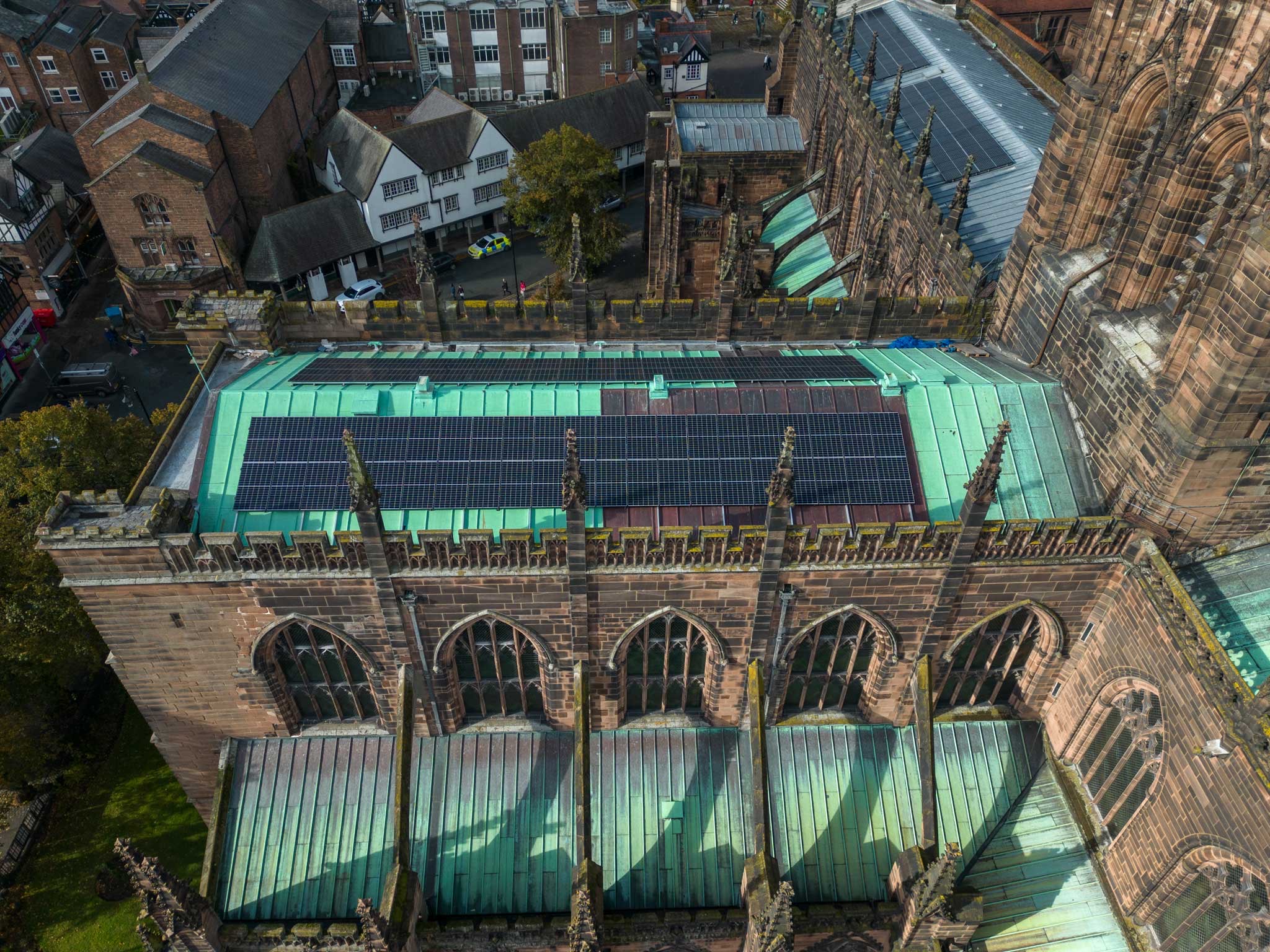 Aerial shot of Chester Cathedral with solar panels on roof