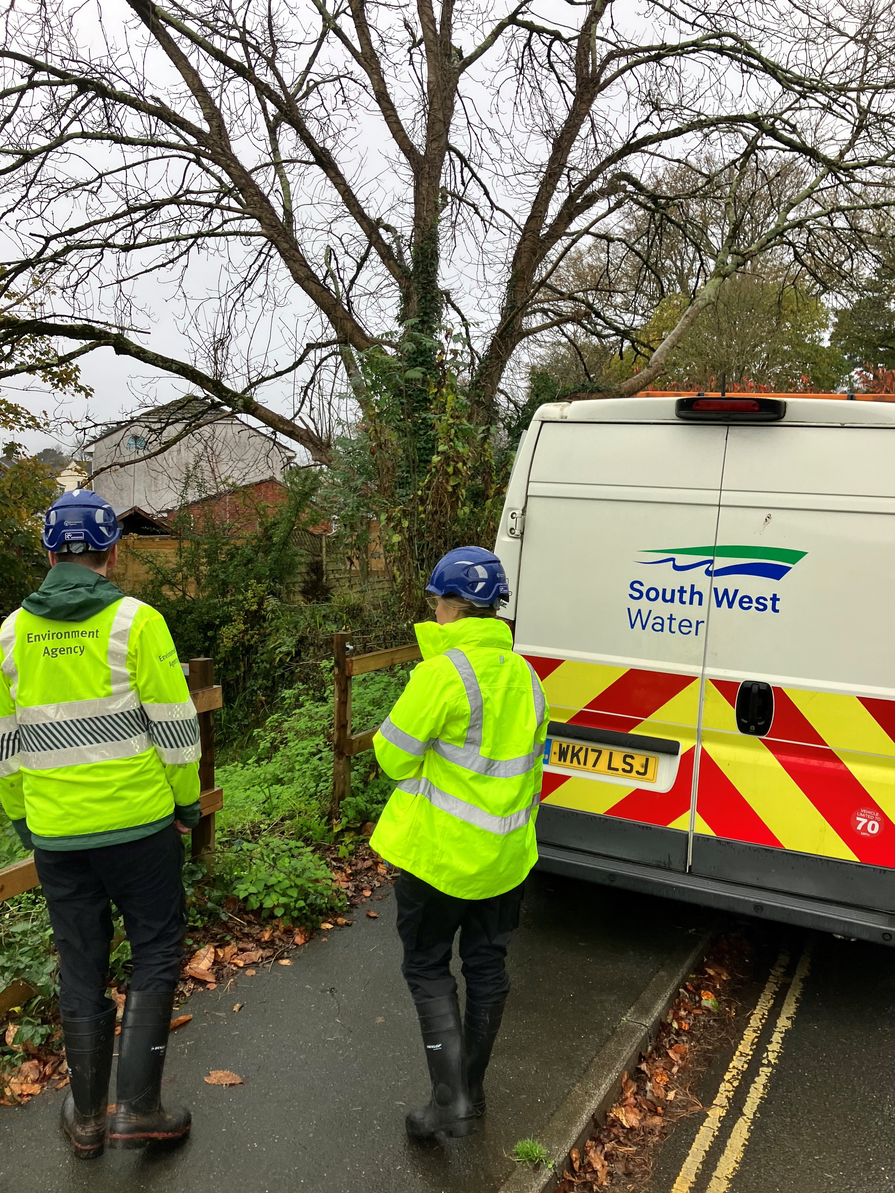 Environment Agency officers meet by a South West Water van to carry out compliance checks.