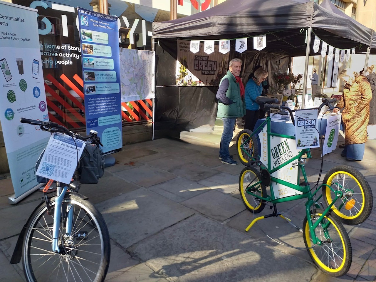 Image of people at a stall with bikes in front