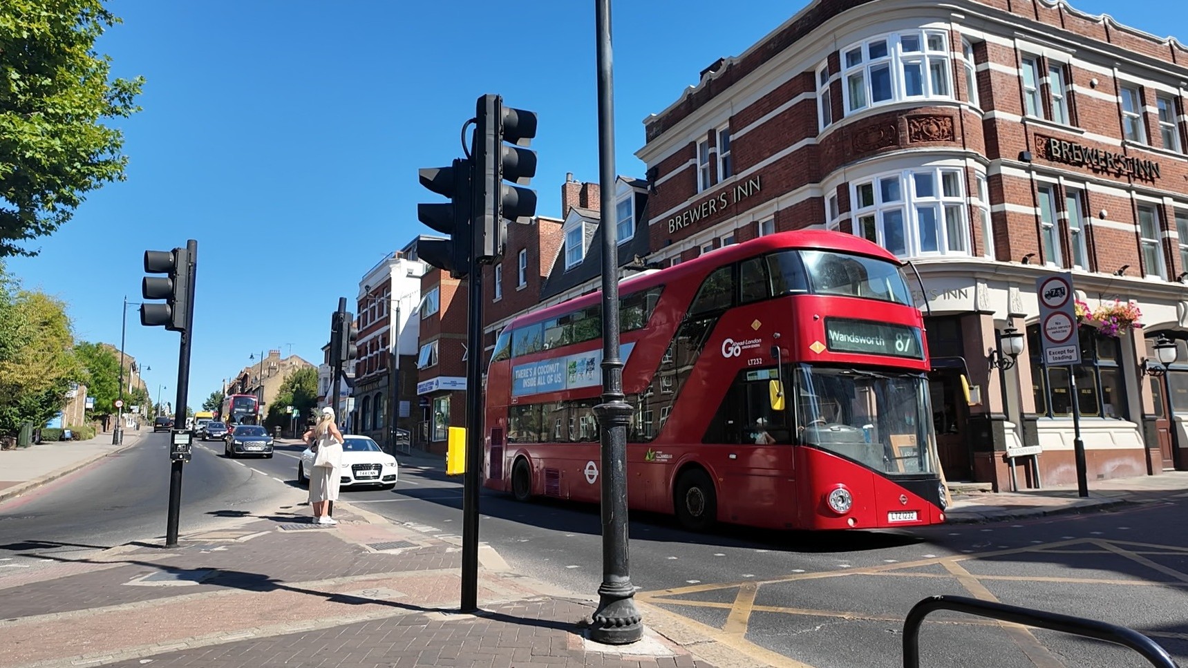 East Hill crossing facing Brewer’s Inn with bus 87, cars and a pedestrian 