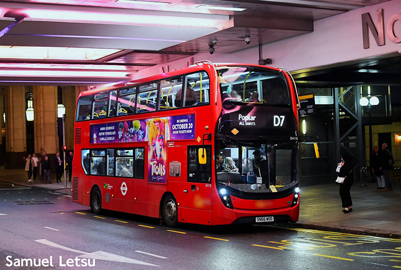 Red double decker Route D7 bus at a city centre bus stop