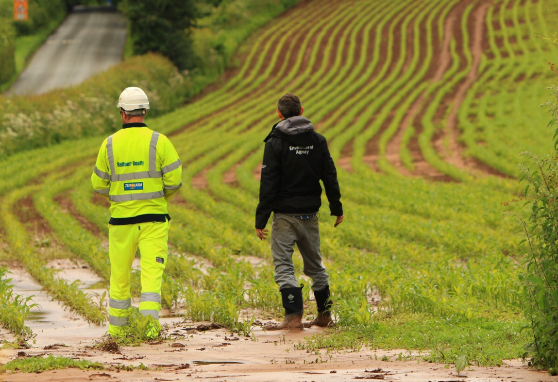Image of officers inspecting farm run off