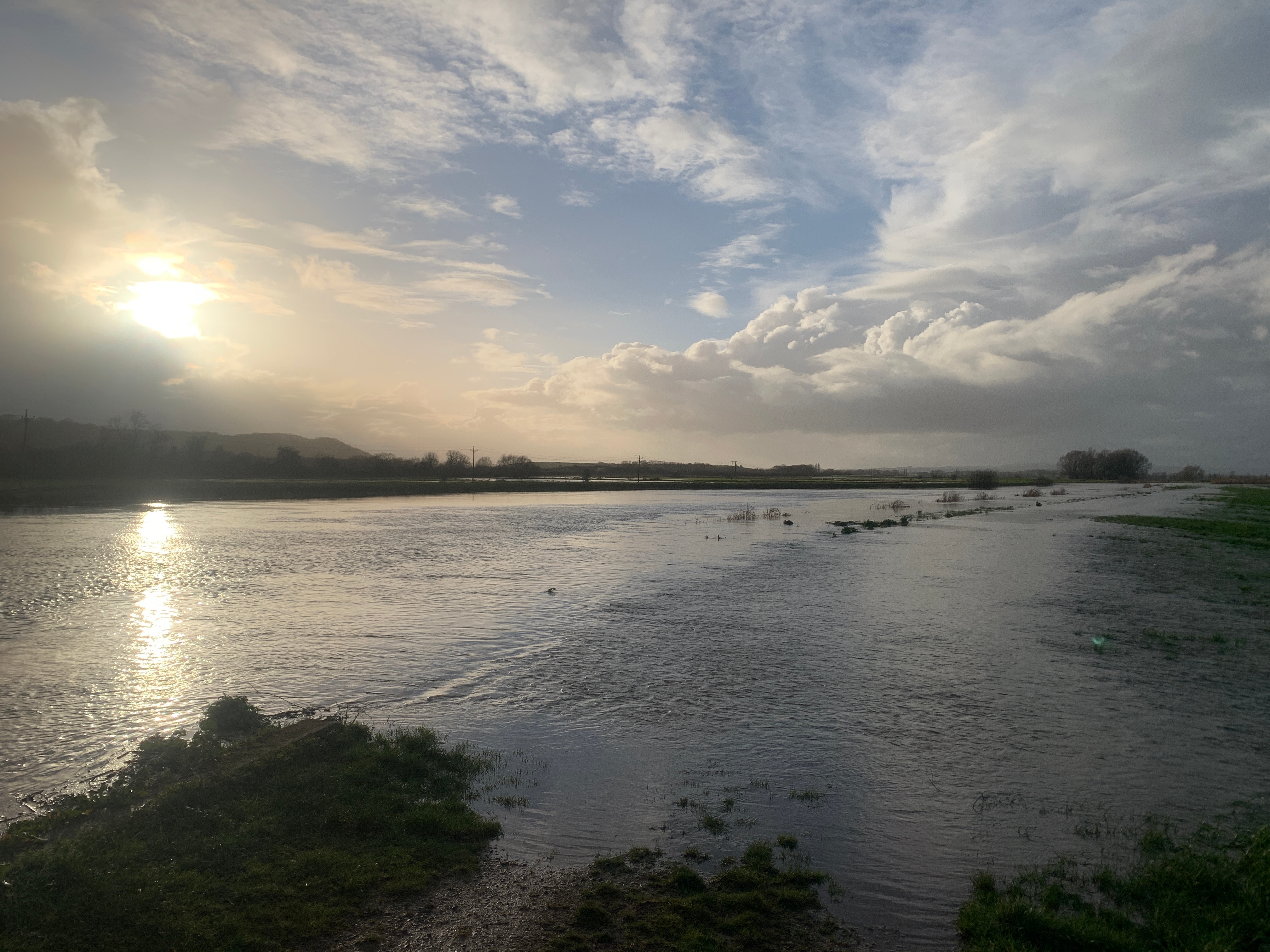 Photo of Allermoor Spillway showing water flowing from the River Parrett to the River Sowy