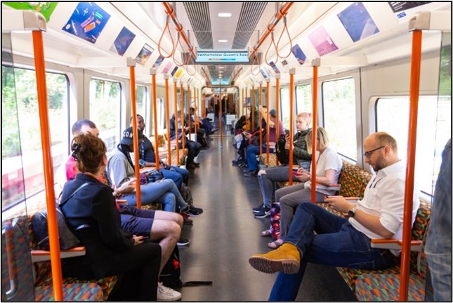 Customers on a London Overground train
