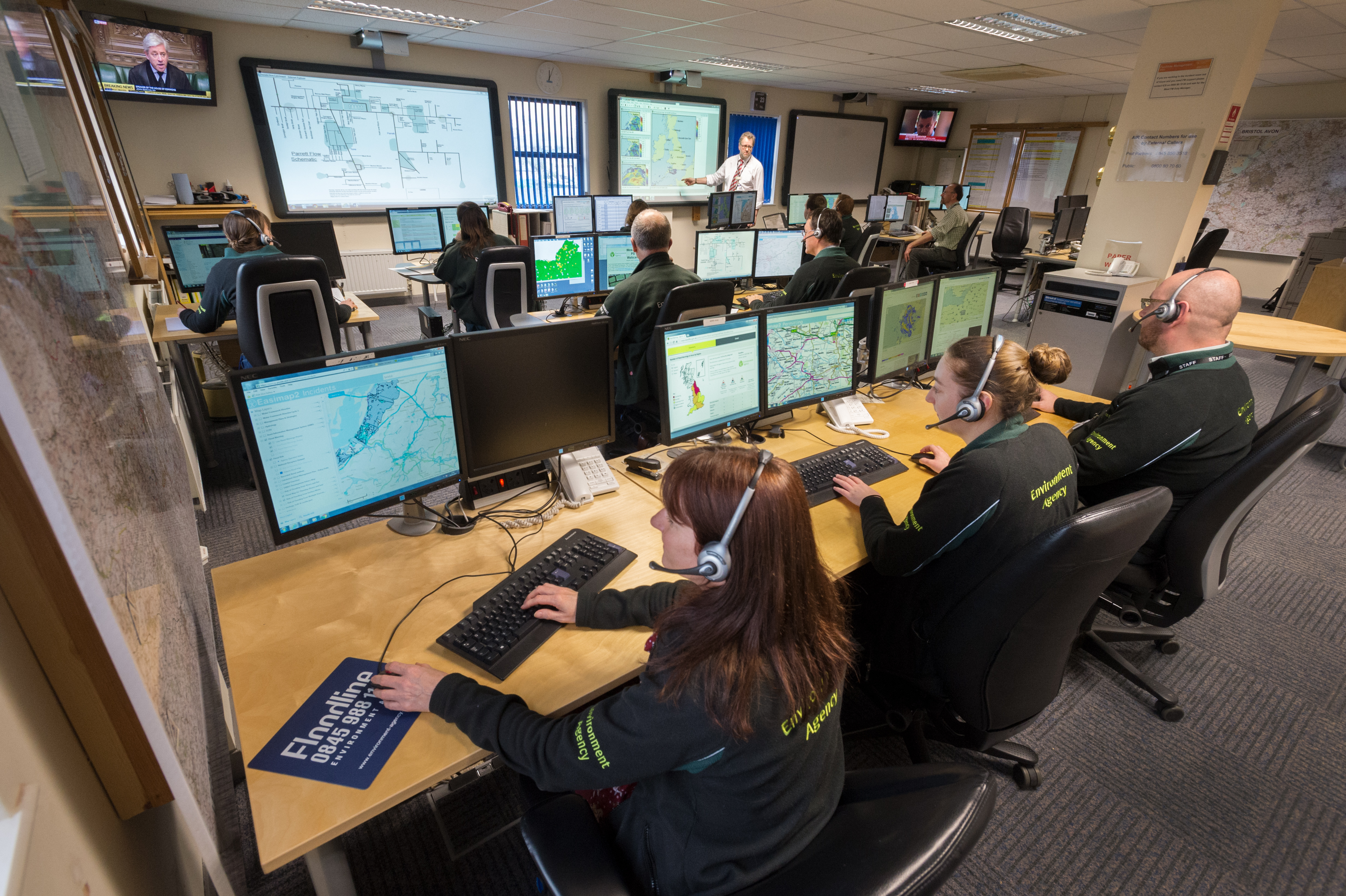 Environment Agency officers working in an incident control room